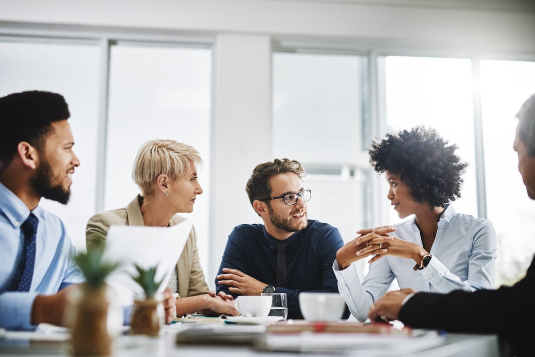 a group of people sitting at a table